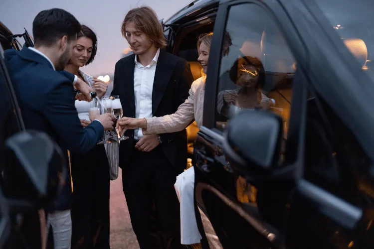 Guests welcomed beside a luxury vehicle for VIP airport assistance