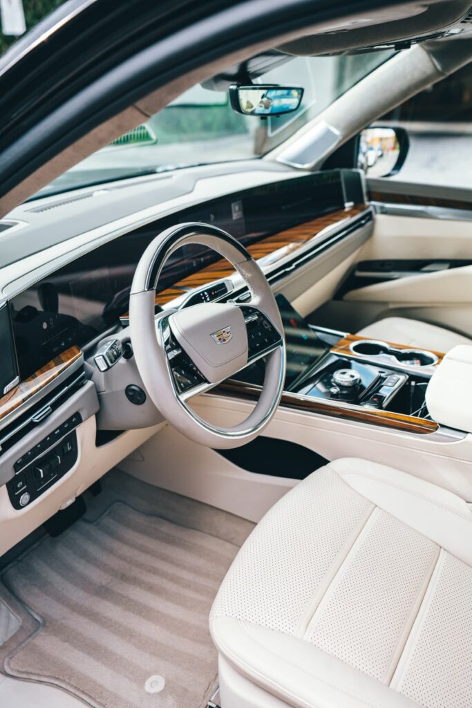 Cadillac Escalade interior with cream leather seats and wood trim