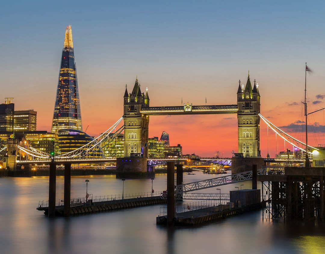 Tower Bridge and The Shard beside the River Thames at sunset
